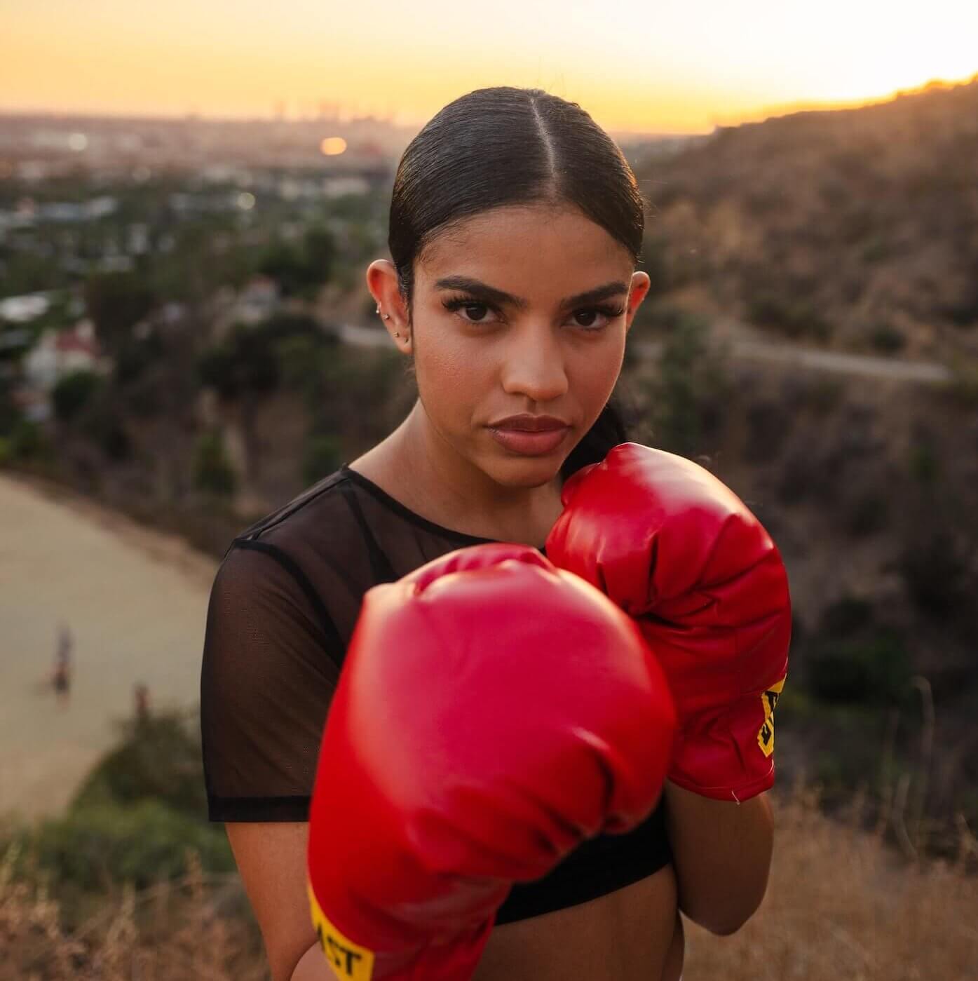 beautiful woman with boxing gloves on