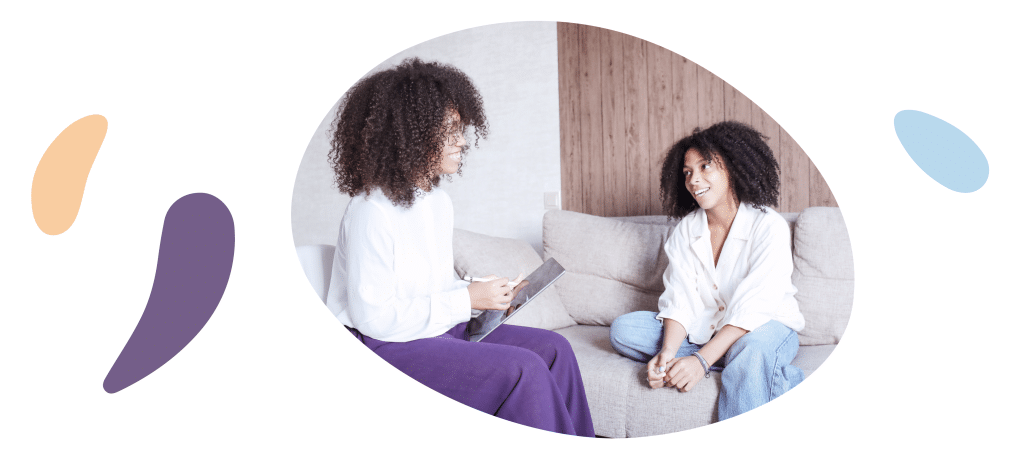two women in a therapy session about how to let go of the past and regulate negative emotions