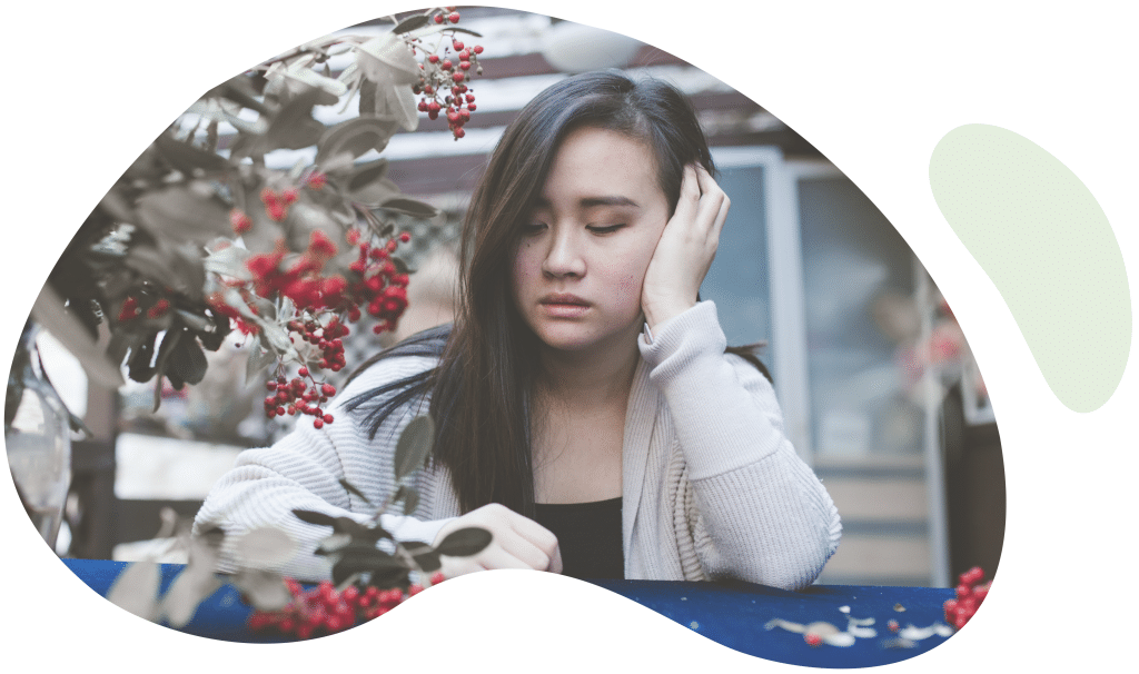 Girl, sad during the holidays due to social stressors
